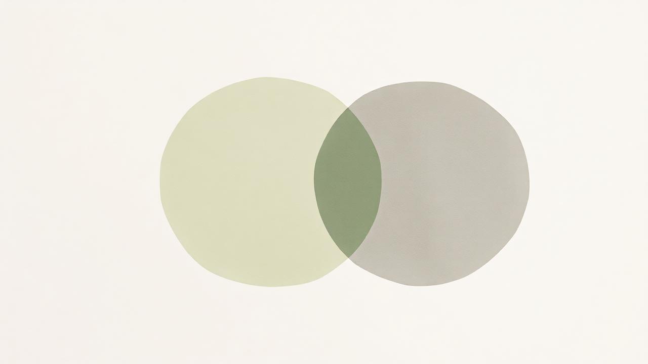 Two overlapping translucent watercolour circles in sage green and grey on cream paper